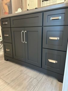 Custom modern bathroom vanity with gray cabinetry in a Brookwood home in Fort Wayne, Indiana